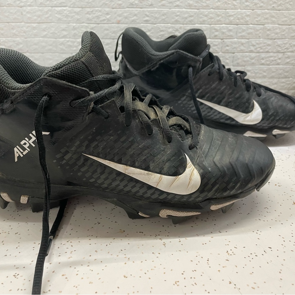 Nike Alpha Black Cleats youth size 6. Used 2 seasons still have few more in them
